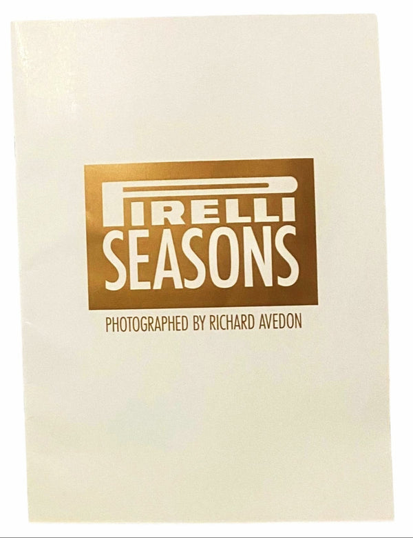 Book cover of 'Pirelli Seasons' with gold text on a beige background