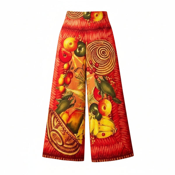 Red wide-leg cropped pants featuring a vibrant fruit and spiral pattern, shown against a plain white background.